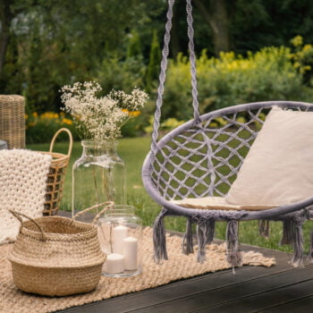 Pillow On Hanging Chair And Basket On Carpet In The Garden Durin